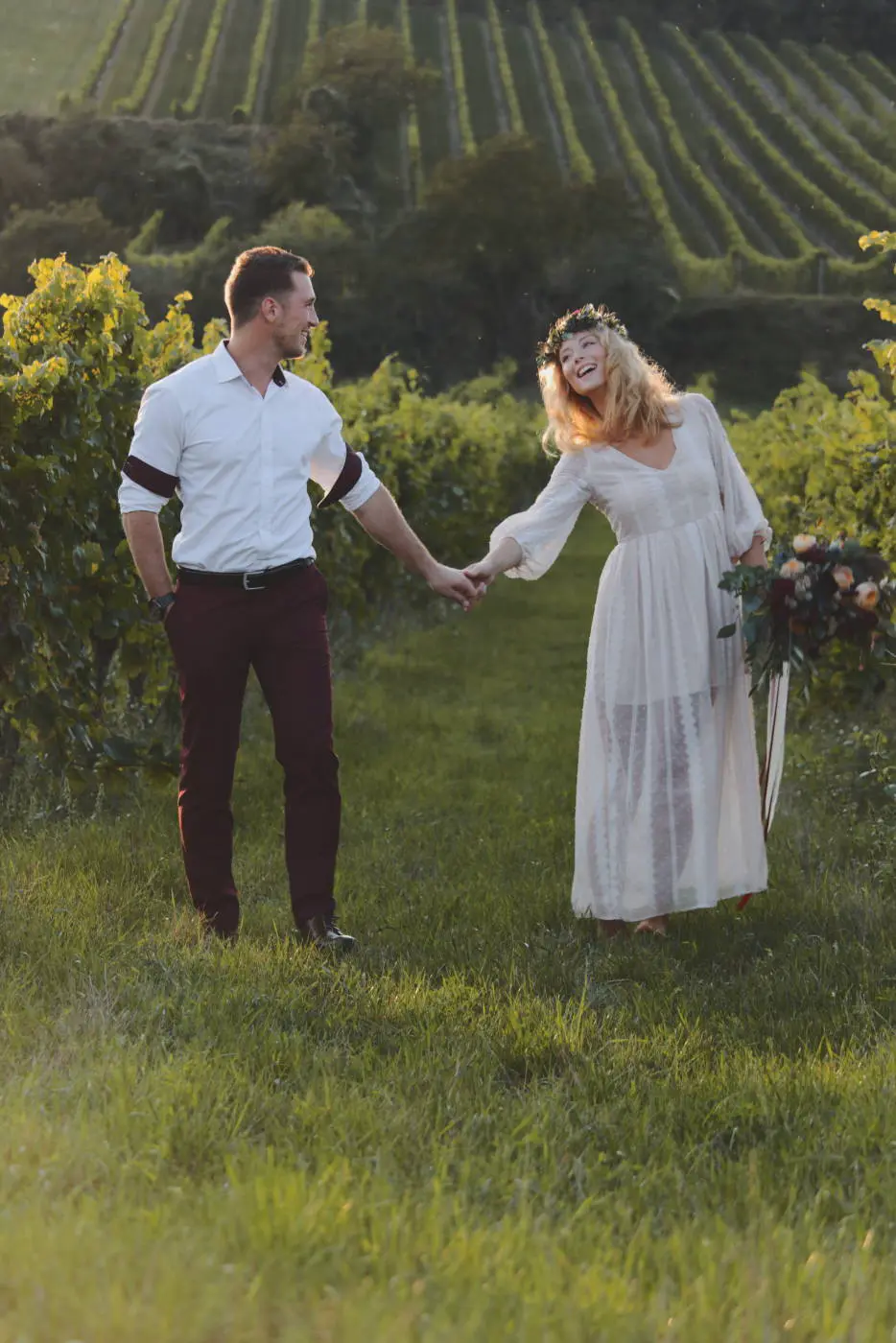 Engagement couple backlit green field