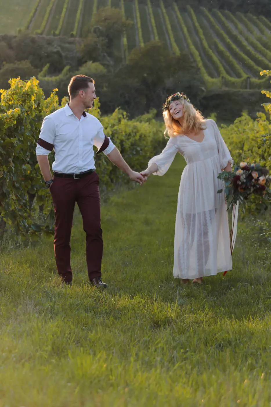 Engagement couple backlit green field