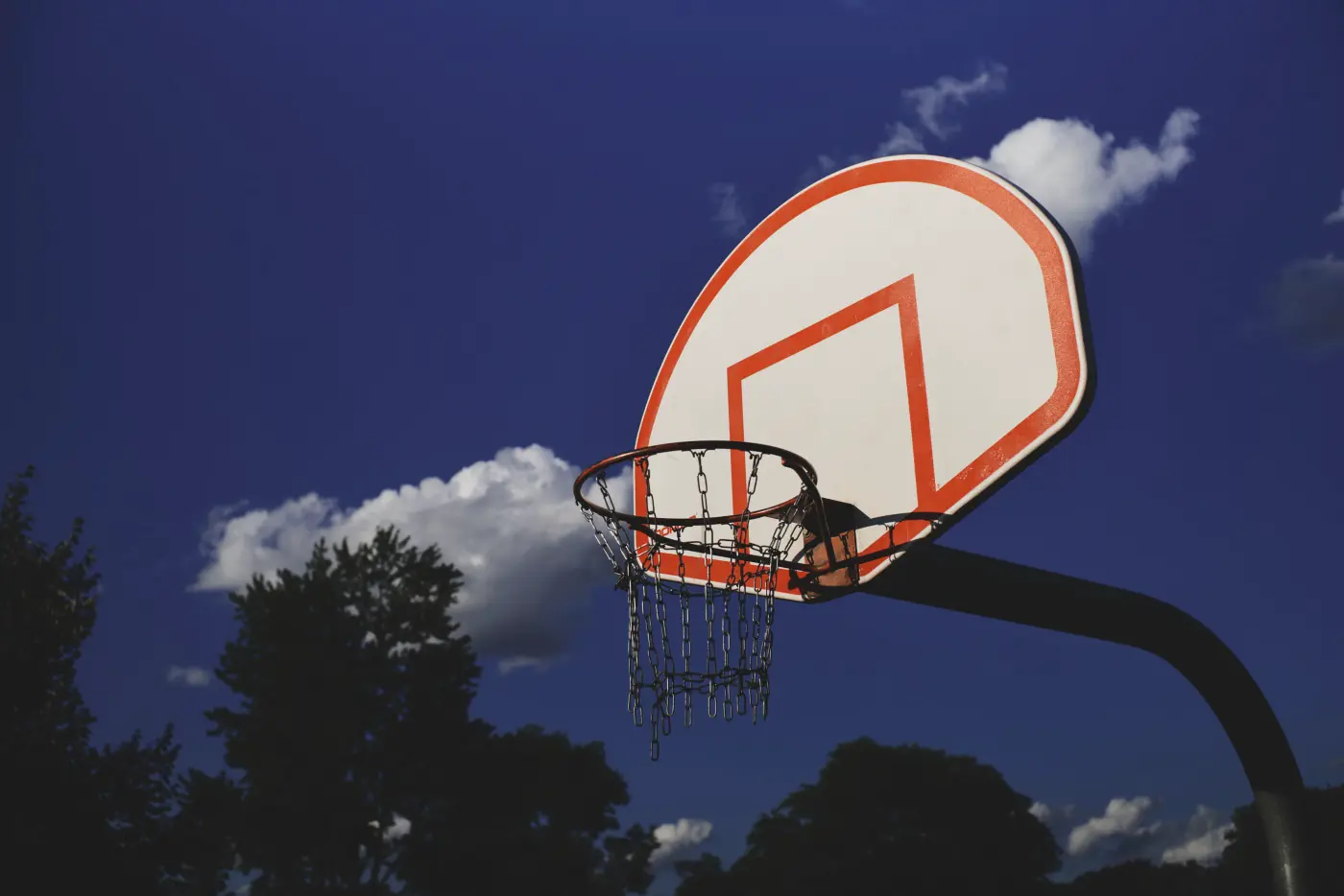 Basketball hoop dark blue sky