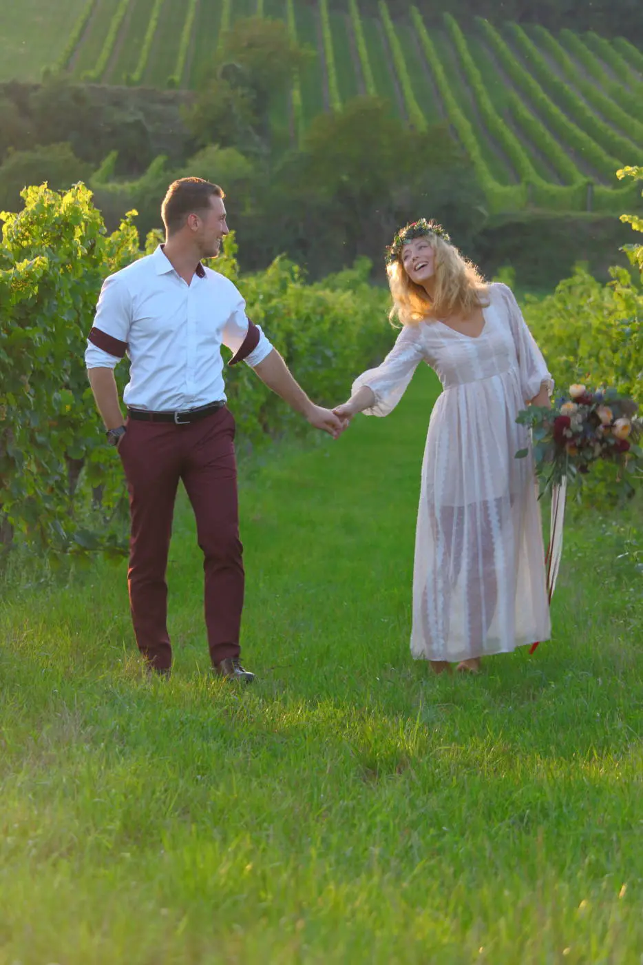Engagement couple backlit green field
